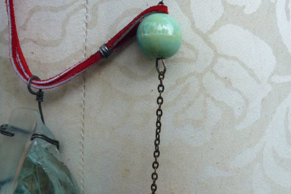 Looking glass mannequin bust steel wire red suede necklace