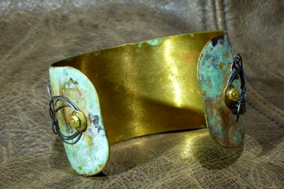 Embossed brass cuff with patina and steel
