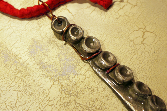 Concrete octopus necklace with recycled red cord