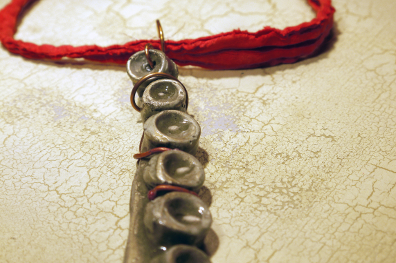 Concrete octopus necklace with recycled red cord