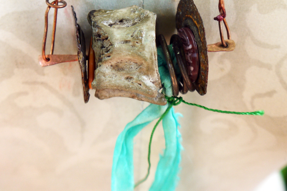Concrete vertebrae necklace with found objects