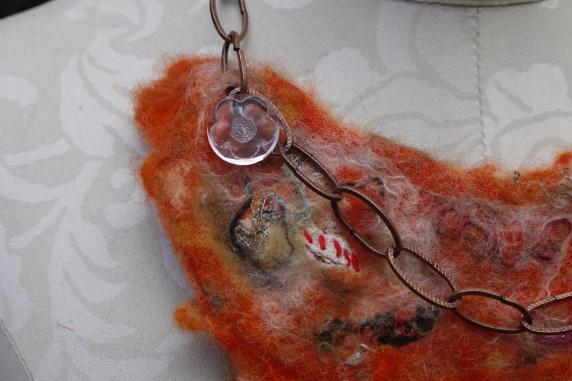 Orange felted yarn necklace with copper chain and vintage buttons