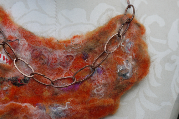 Orange felted yarn necklace with copper chain and vintage buttons