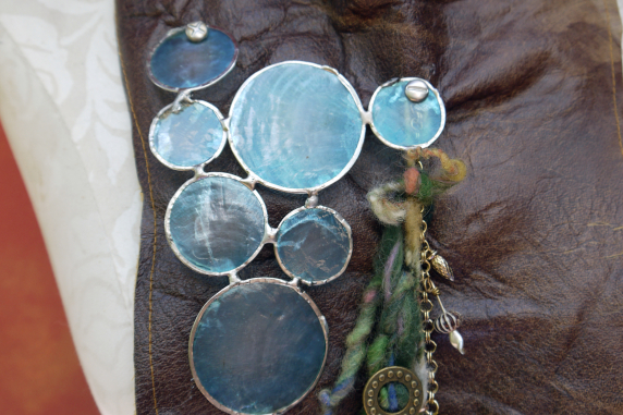 Gathered brown leather fringe bib necklace with blue capiz shell