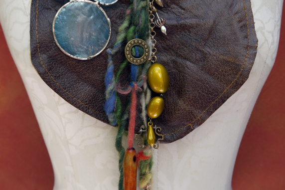 Gathered brown leather fringe bib necklace with blue capiz shell