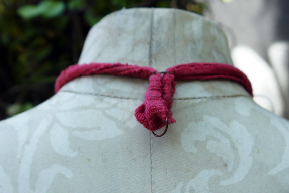 Recycled sewing machine part with hanging charm necklace