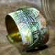 Embossed brass cuff with patina and steel