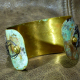 Embossed brass cuff with patina and steel