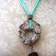 aqua silk ribbon Cholla disc necklace with enameled #8 and a bottlecap accent