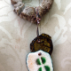 resin coated bottle cap Cholla disc necklace with enameled #8 and a bottlecap accent