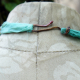 hook closure Cholla disc necklace with enameled #8 and a bottlecap accent
