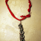 recycled red dhurrie rug as chain Concrete octopus necklace with recycled red cord