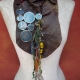 Gathered brown leather fringe bib necklace with blue capiz shell