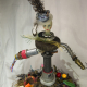 cast resin painted face, pine cone hat 3d art sculpture