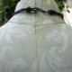 back hook closure, green bead accent Chunky relics and ruins orange tone concrete shard necklace