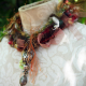 warm muted colors Yarn fringe mixed media charm necklace