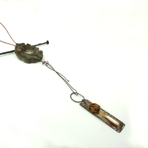 Concrete choya disc with dangling enamel charm