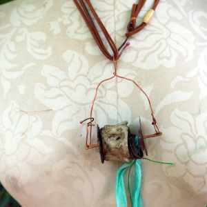 Concrete vertebrae necklace with found objects