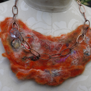 Orange felted yarn necklace with copper chain and vintage buttons