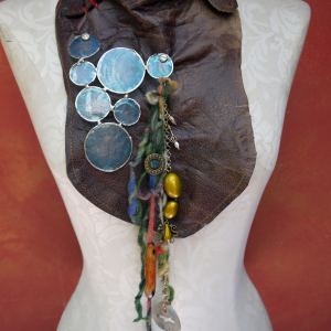 Gathered brown leather fringe bib necklace with blue capiz shell