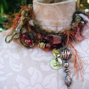 Yarn fringe mixed media charm necklace