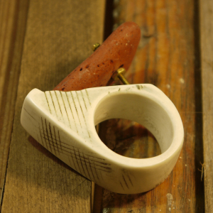 Faux bone ring with found brick and screw 